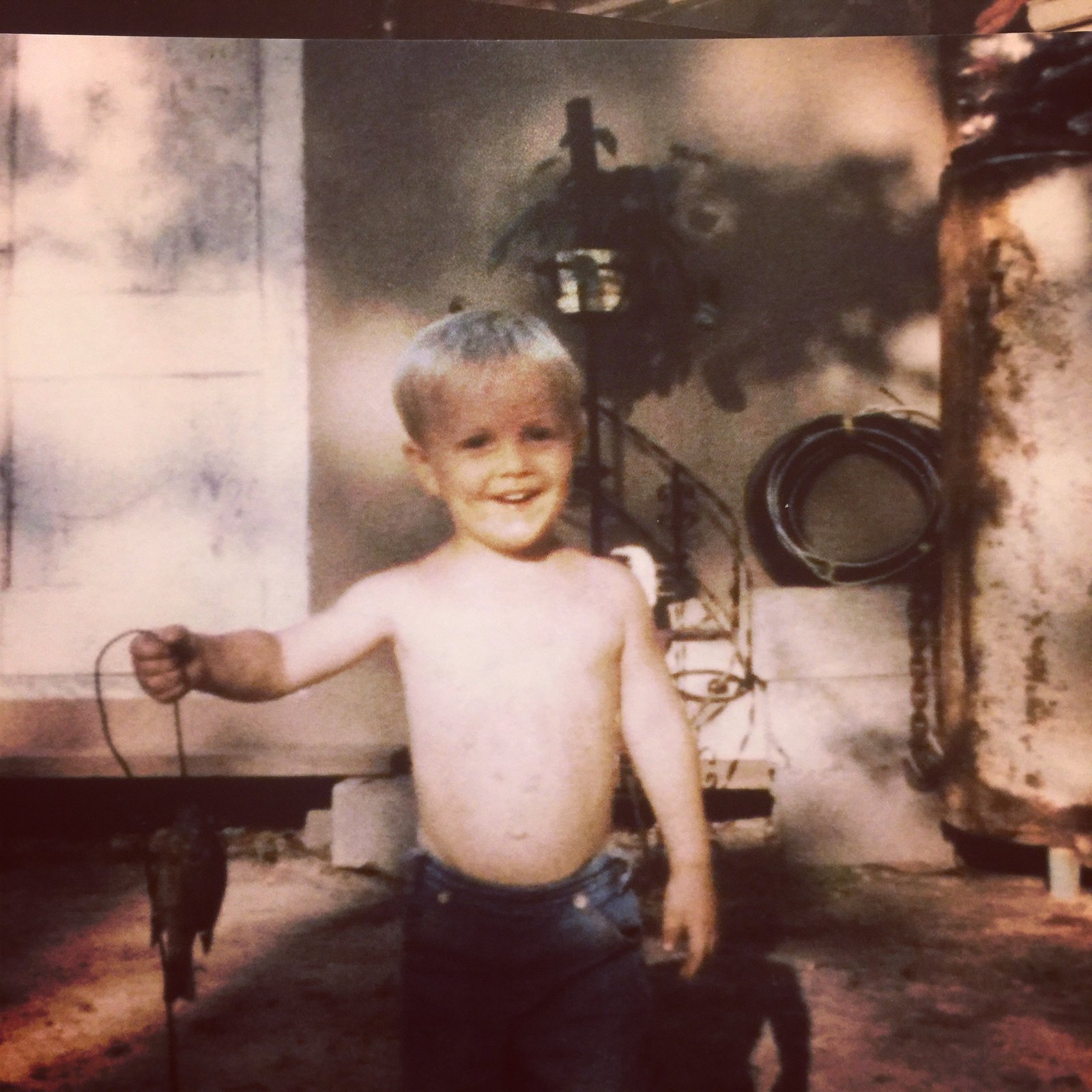 Childhood photo holding my first fish, East Texas